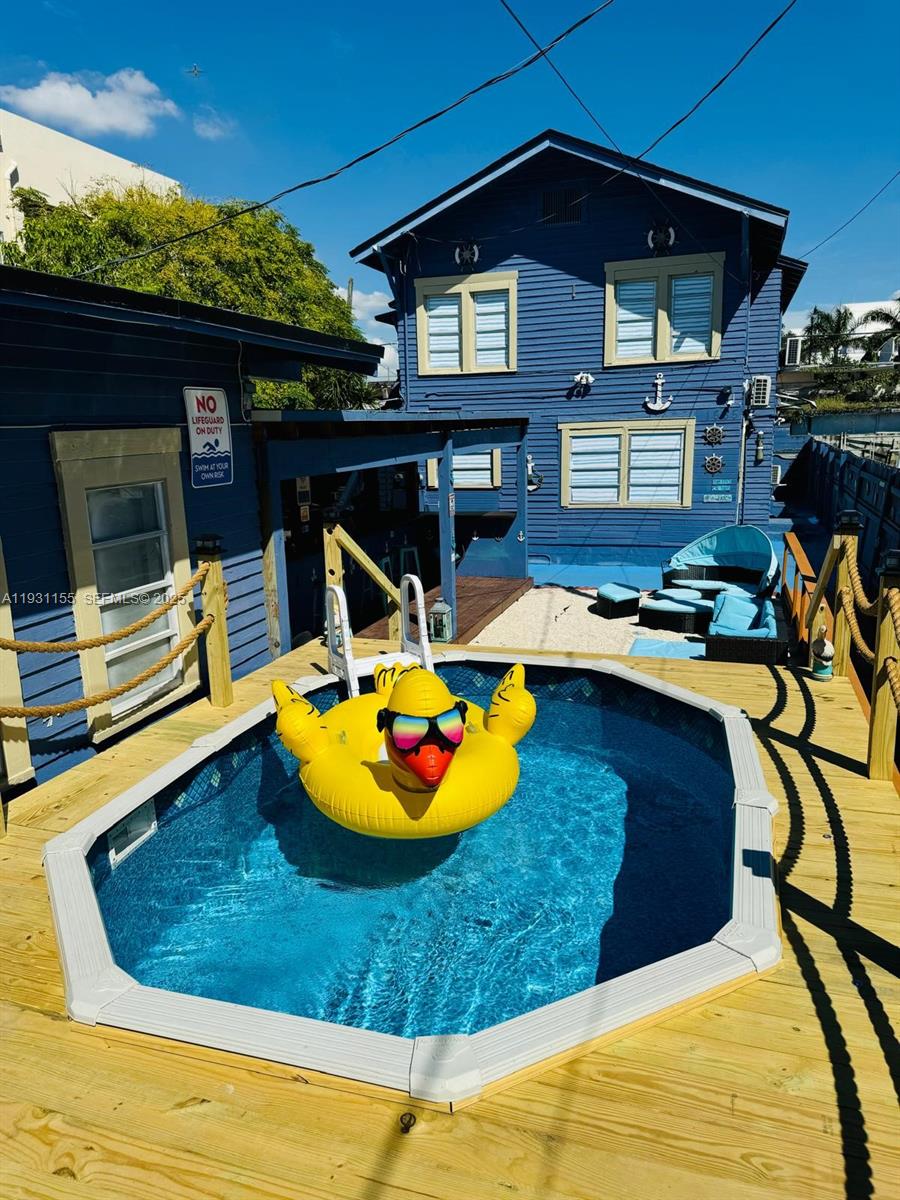 a view of a swimming pool with an outdoor seating