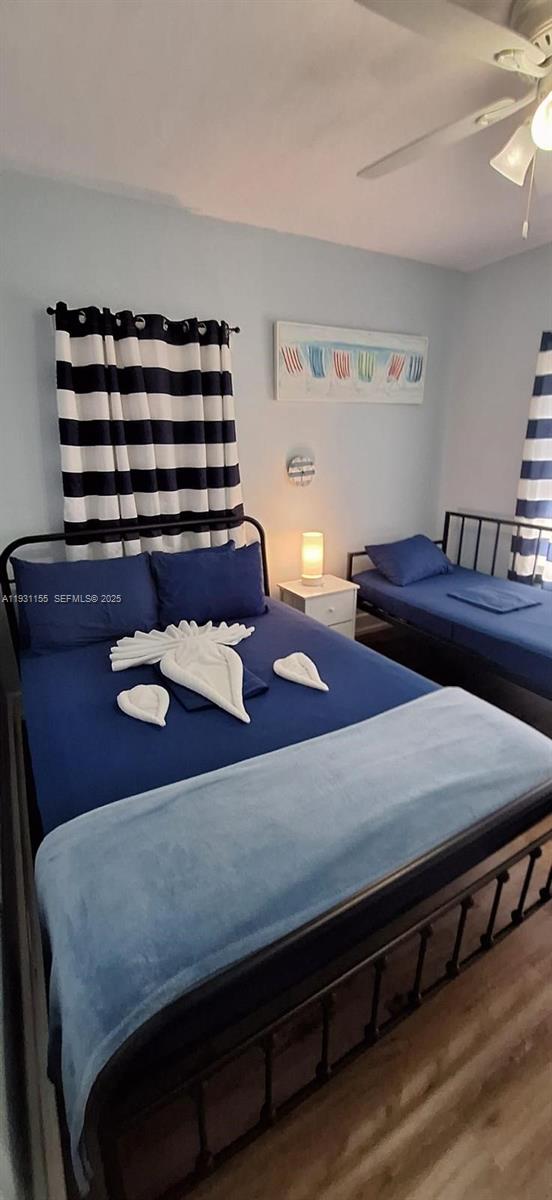 1535 Southwest 2nd Street Miami, FL 33135 - Photo 11 of 38 a bedroom with a bed and a dresser