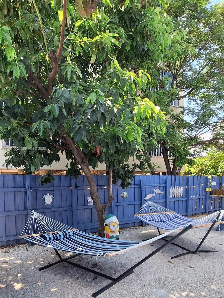 1535 Southwest 2nd Street Miami, FL 33135 - Photo 13 of 38 a backyard of a house with table and chairs