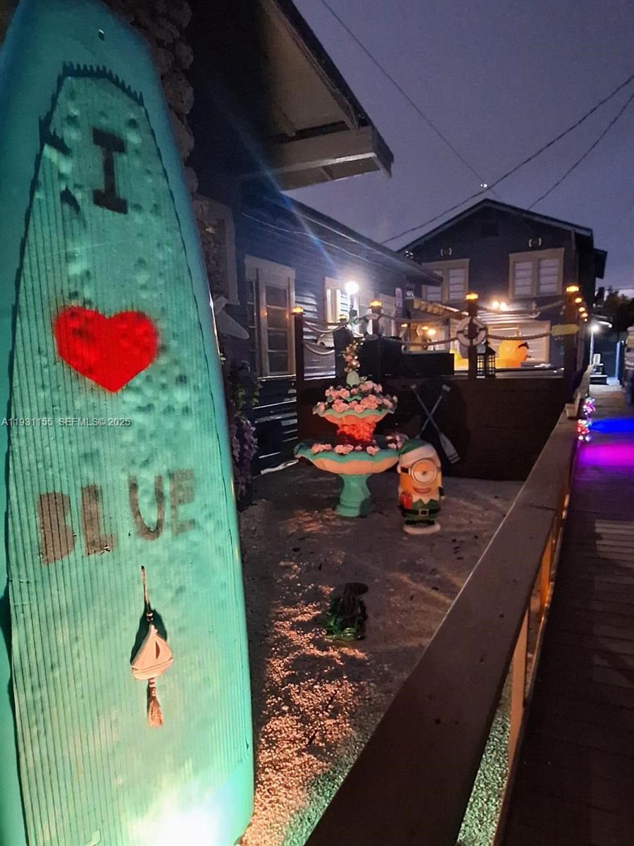 1535 Southwest 2nd Street Miami, FL 33135 - Photo 15 of 38 a play room with water heater and wooden floor