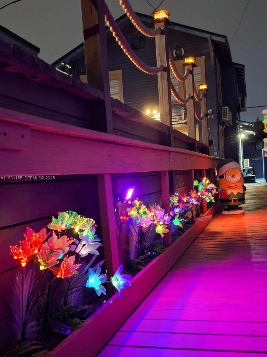 1535 Southwest 2nd Street Miami, FL 33135 - Photo 16 of 38 a room with lots of flowers and a fireplace