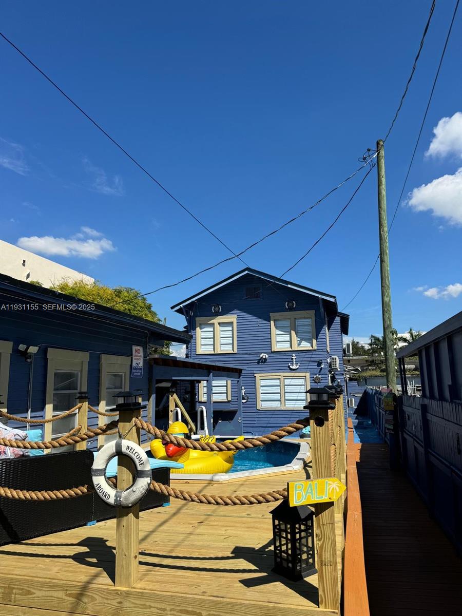 1535 Southwest 2nd Street Miami, FL 33135 - Photo 2 of 38 a view of a house with swimming pool and sitting area