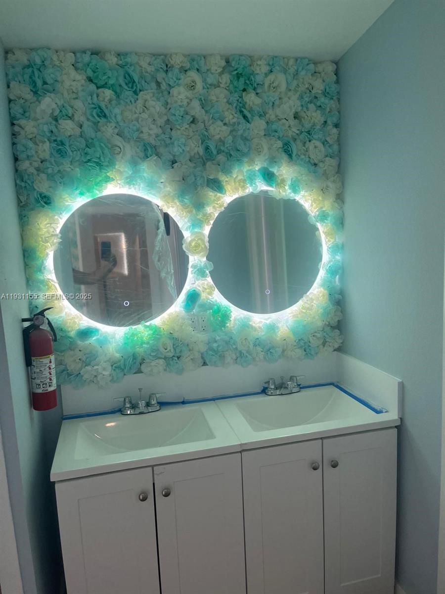 1535 Southwest 2nd Street Miami, FL 33135 - Photo 25 of 38 a bathroom with a sink and mirror