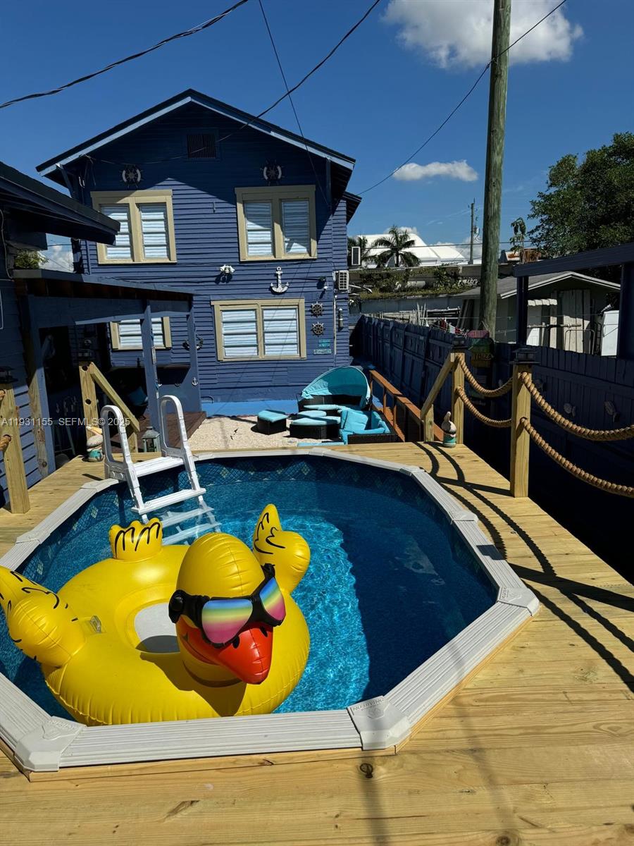1535 Southwest 2nd Street Miami, FL 33135 - Photo 3 of 38 a view of a swimming pool with outdoor seating