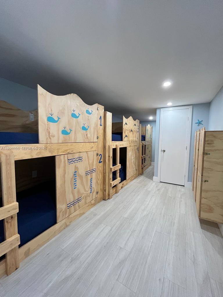 1535 Southwest 2nd Street Miami, FL 33135 - Photo 33 of 38 a kitchen with stainless steel appliances a refrigerator and a fireplace