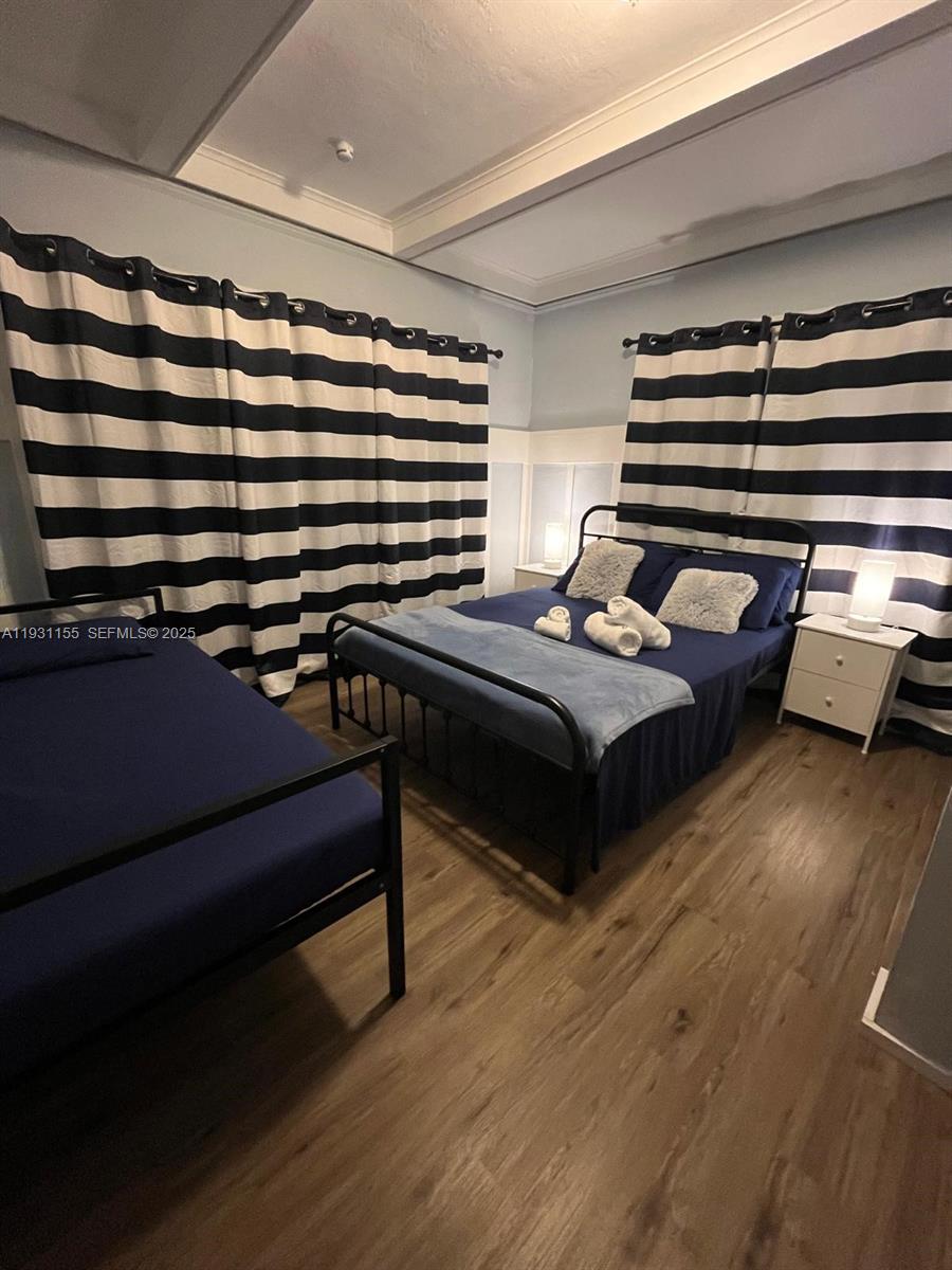 1535 Southwest 2nd Street Miami, FL 33135 - Photo 10 of 38 a bedroom with a bed and a dresser