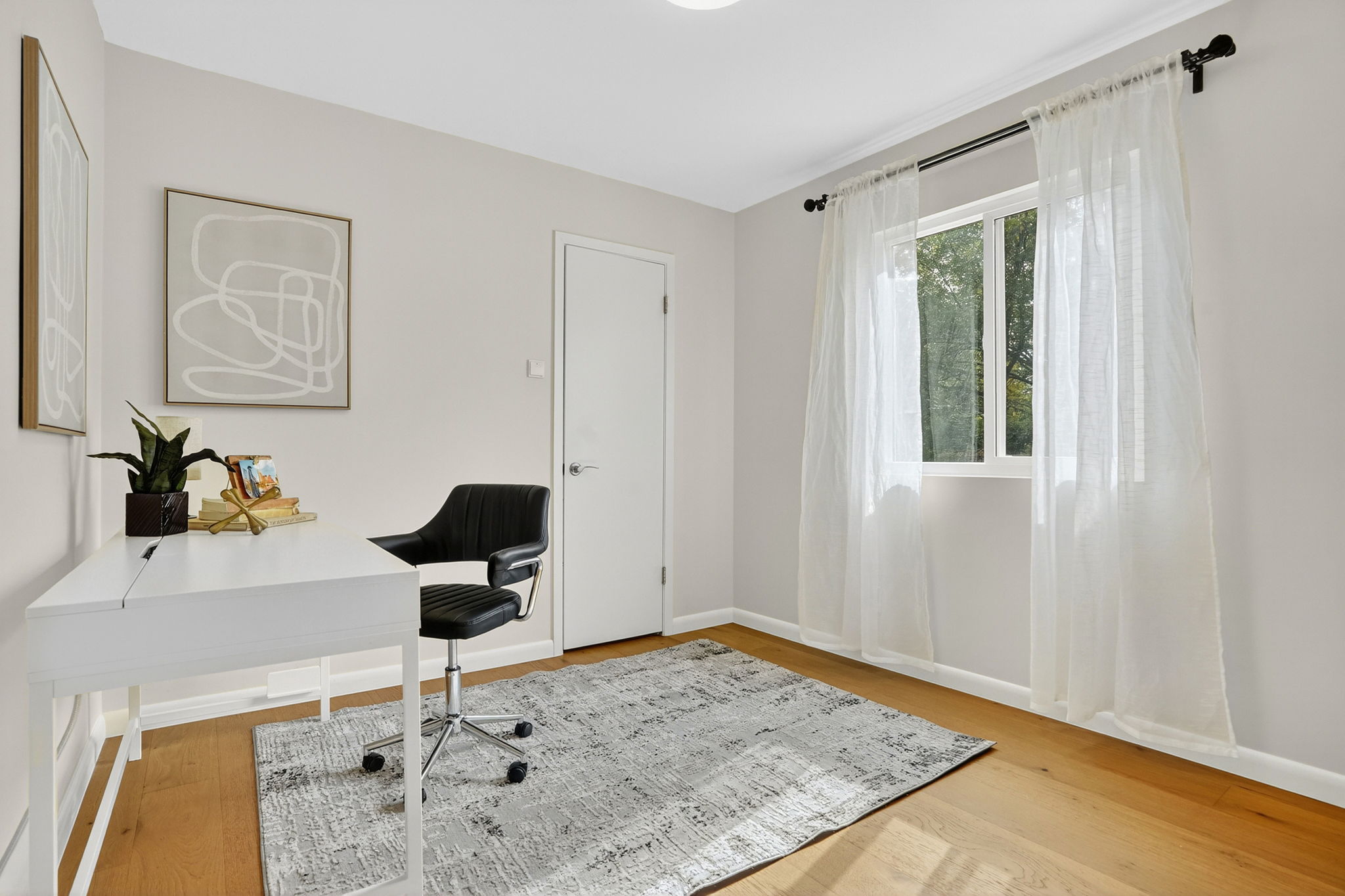 3202 Western Drive Austin, TX 78745 - Photo 16 of 34 a view of a workspace room with wooden floor and bathroom