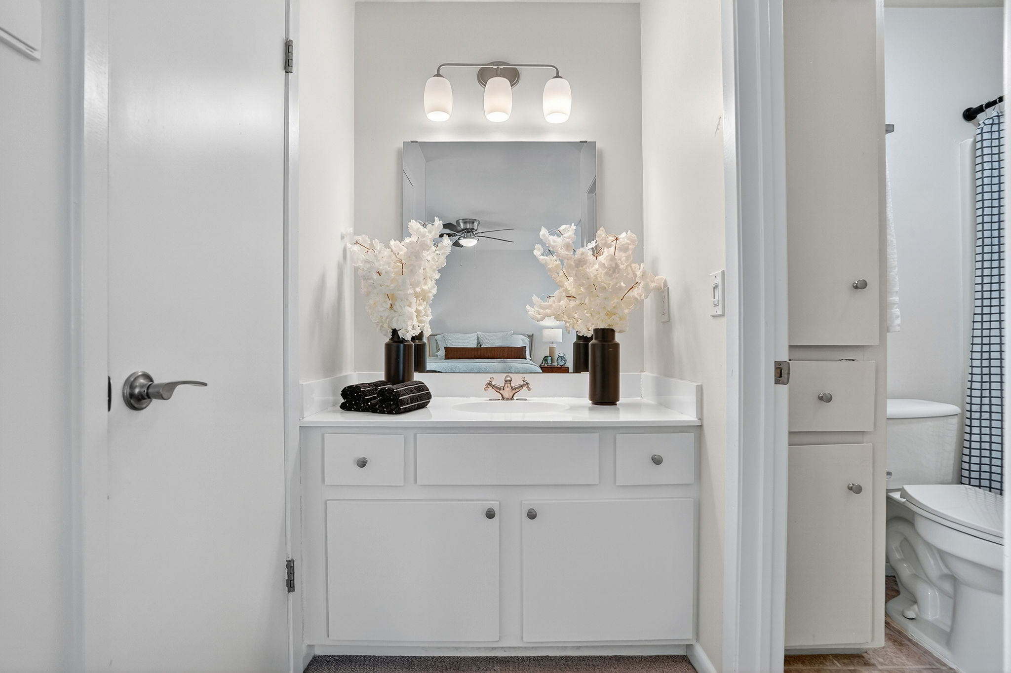 3202 Western Drive Austin, TX 78745 - Photo 17 of 34 a bathroom with a sink vanity and mirror