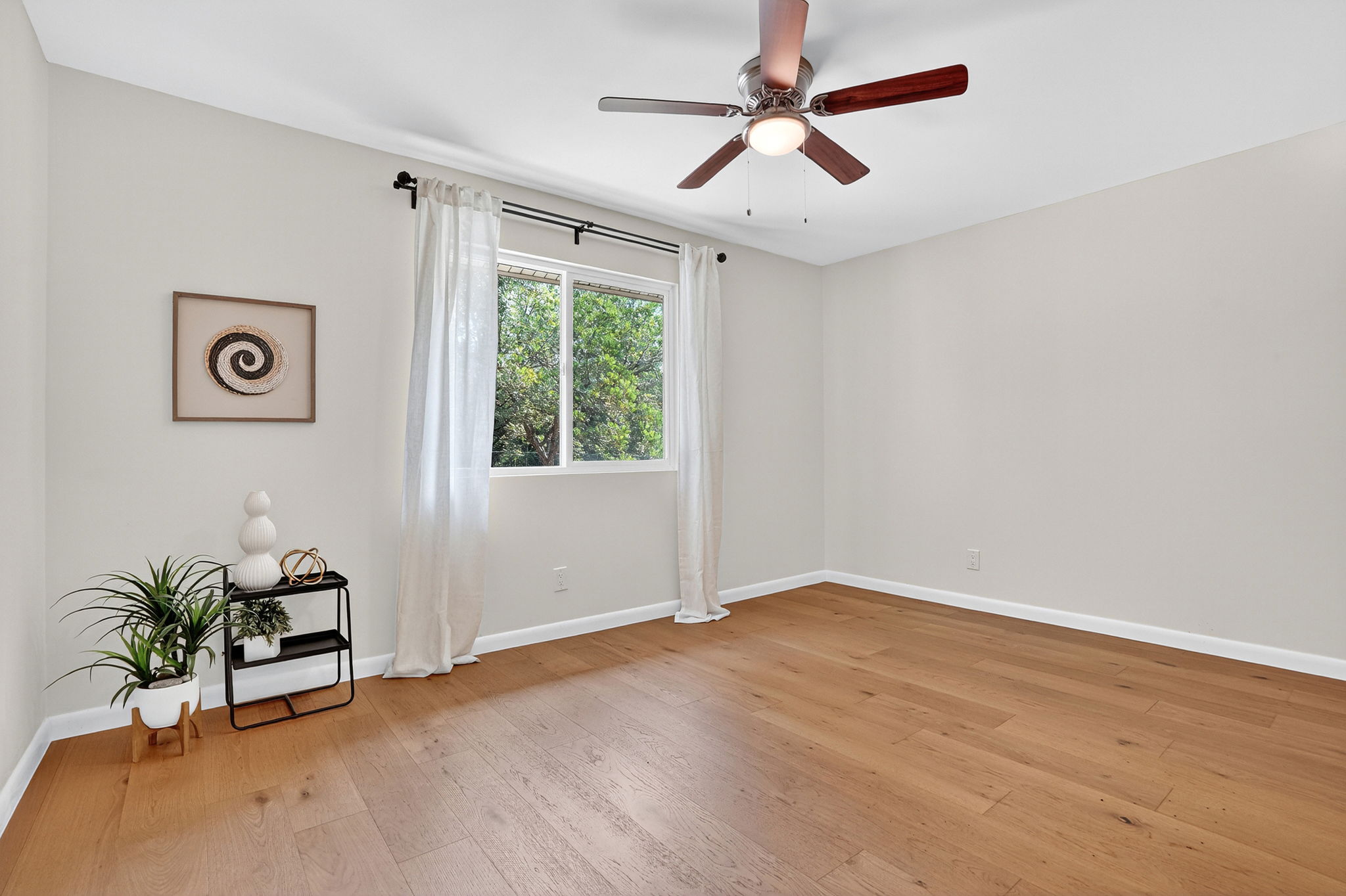 3202 Western Drive Austin, TX 78745 - Photo 19 of 34 an empty room with windows and fan