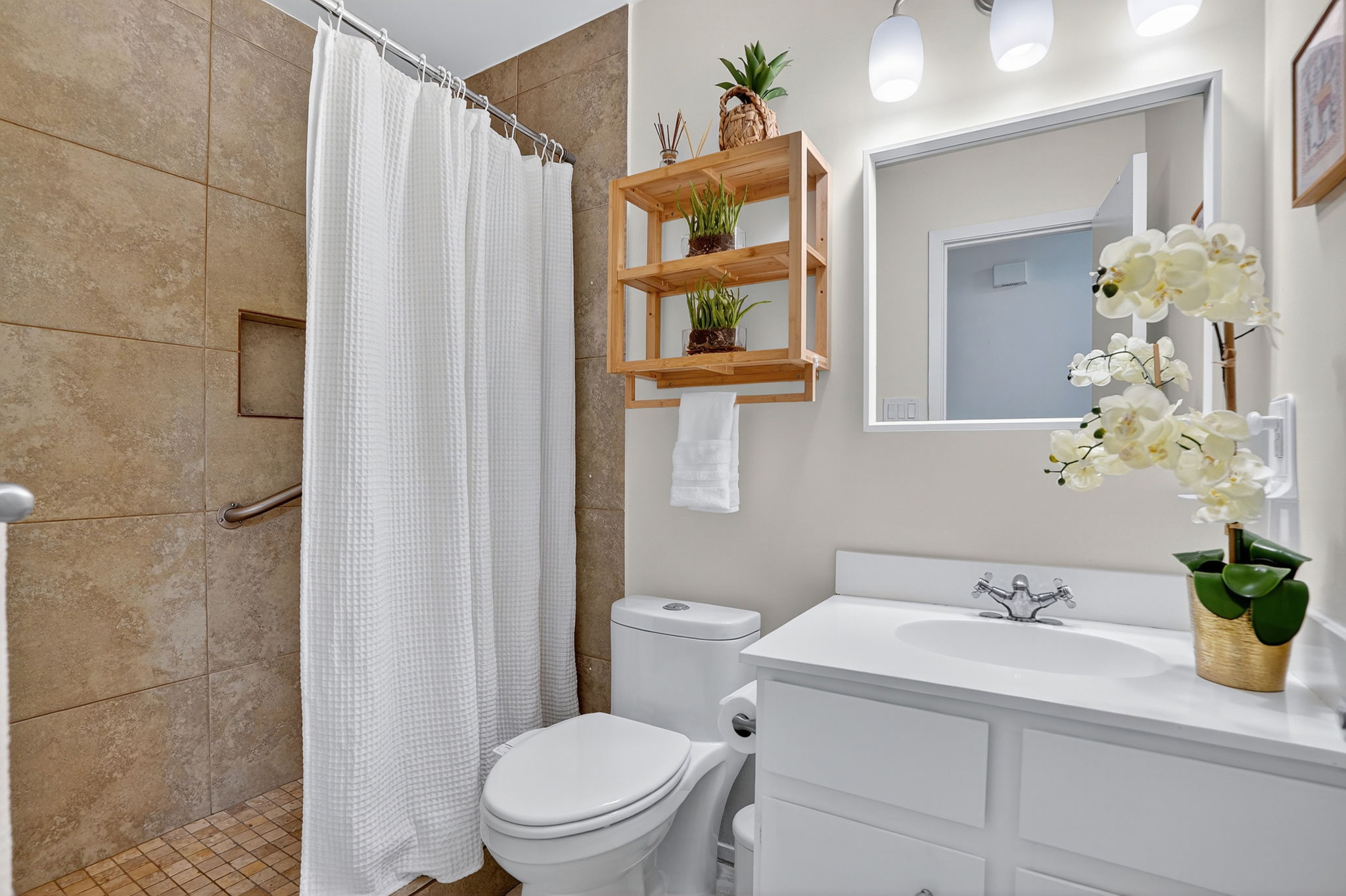 3202 Western Drive Austin, TX 78745 - Photo 20 of 34 a bathroom with a sink a toilet and shower curtain