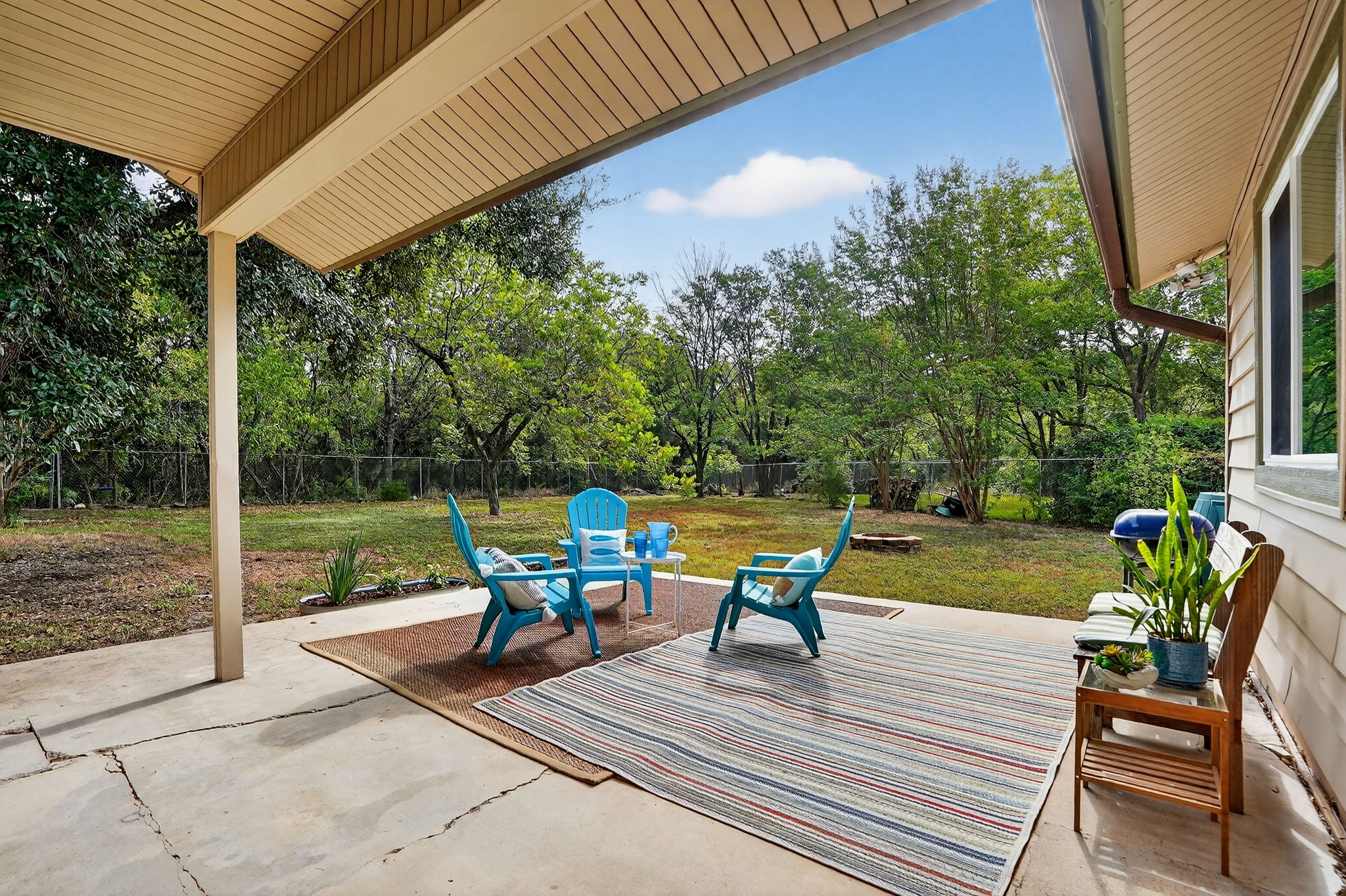 3202 Western Drive Austin, TX 78745 - Photo 24 of 34 a view of a patio with lawn chairs next to a yard