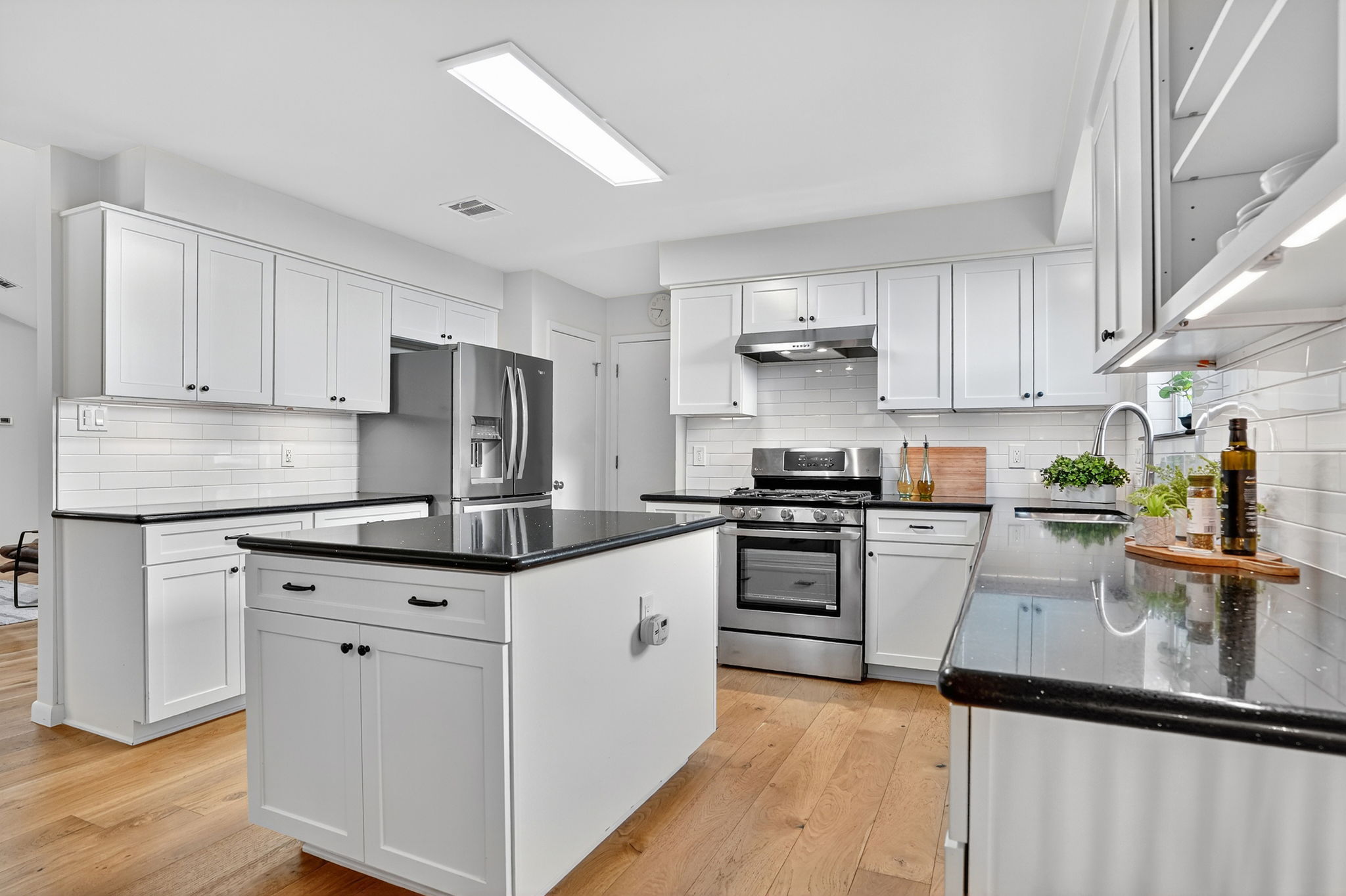 3202 Western Drive Austin, TX 78745 - Photo 8 of 34 a kitchen with granite countertop a sink stove and refrigerator
