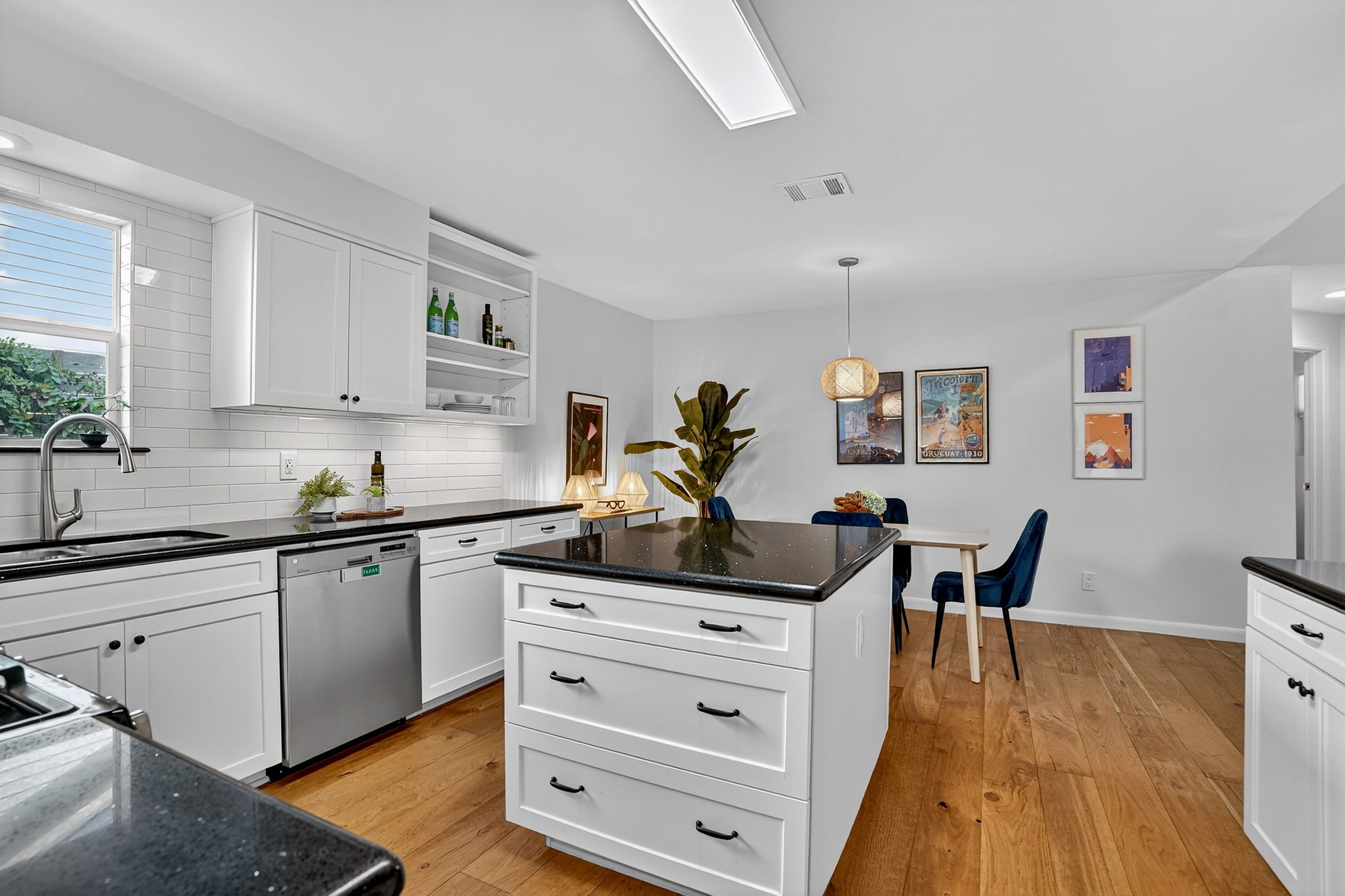 3202 Western Drive Austin, TX 78745 - Photo 9 of 34 a kitchen with stainless steel appliances kitchen island granite countertop a stove a sink and a refrigerator