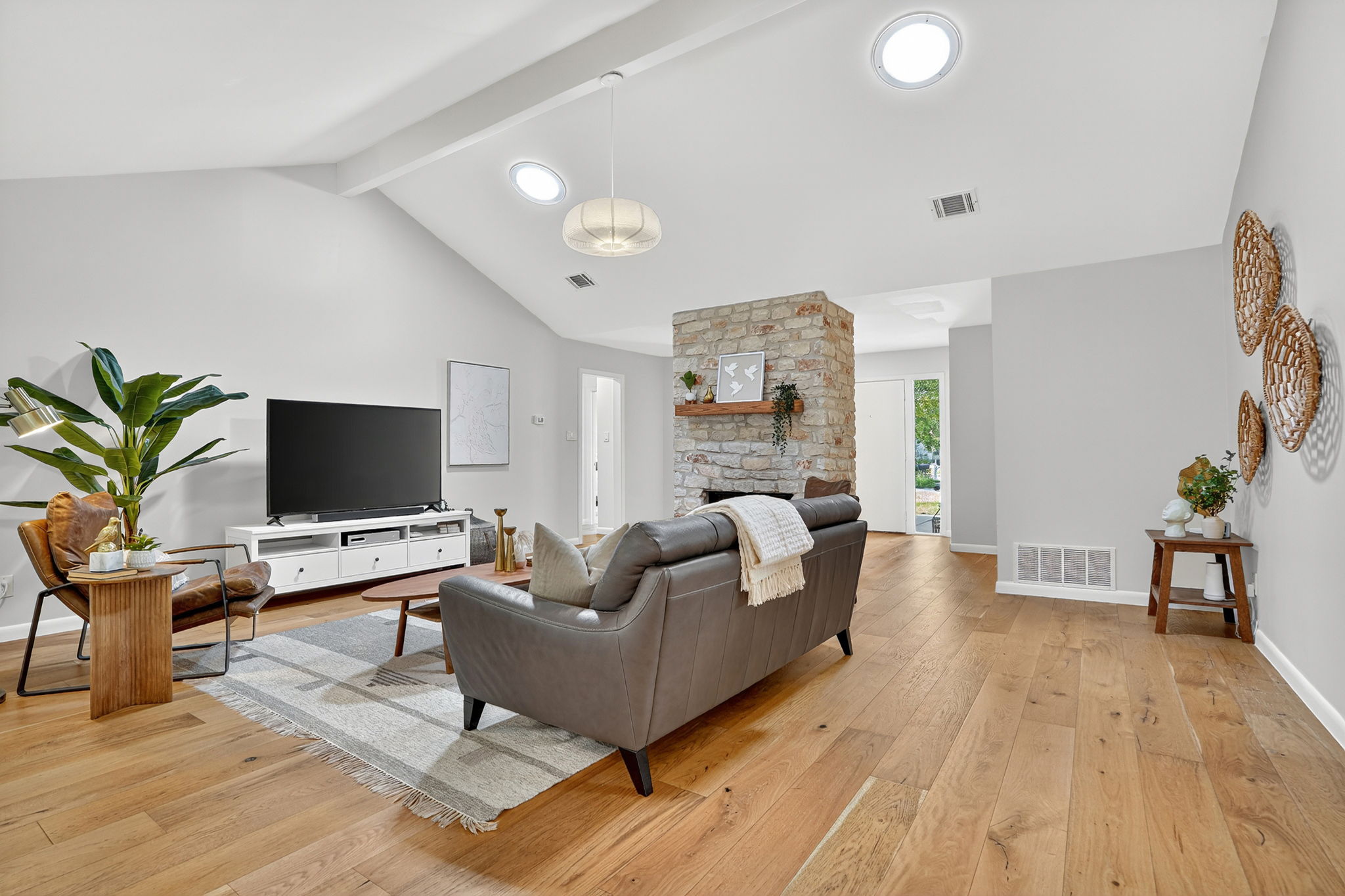 3202 Western Drive Austin, TX 78745 - Photo 10 of 34 a living room with furniture wooden floor and a flat screen tv
