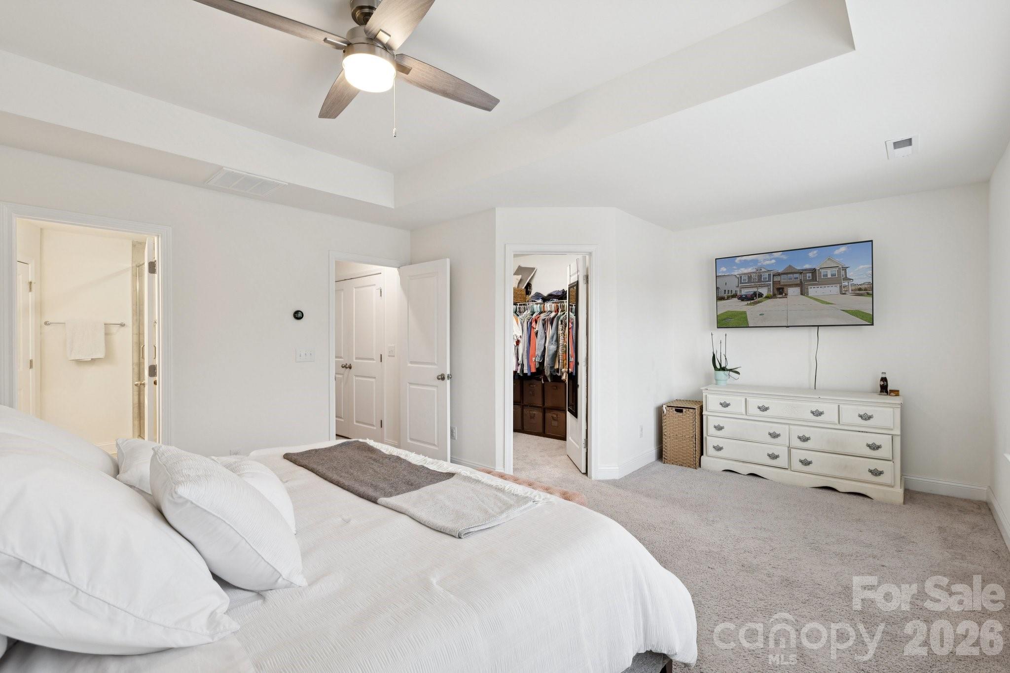 2081 Suttonview Road Fort Mill, SC 29708 - Photo 15 of 33 a bedroom with a bed and a chandelier