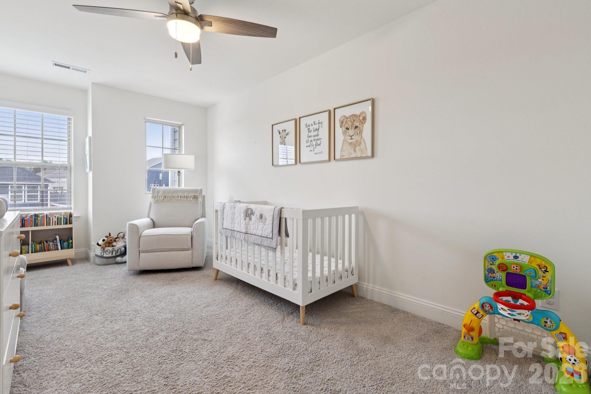 2081 Suttonview Road Fort Mill, SC 29708 - Photo 20 of 33 a bedroom with furniture and a wooden floor