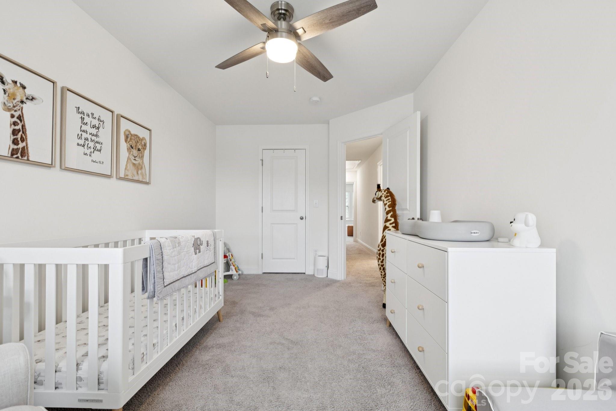 2081 Suttonview Road Fort Mill, SC 29708 - Photo 21 of 33 a bed room with a bed and a chandelier