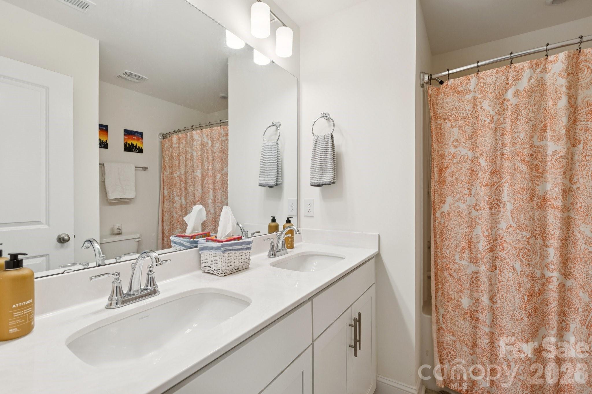 2081 Suttonview Road Fort Mill, SC 29708 - Photo 24 of 33 a bathroom with a double vanity sink and a mirror