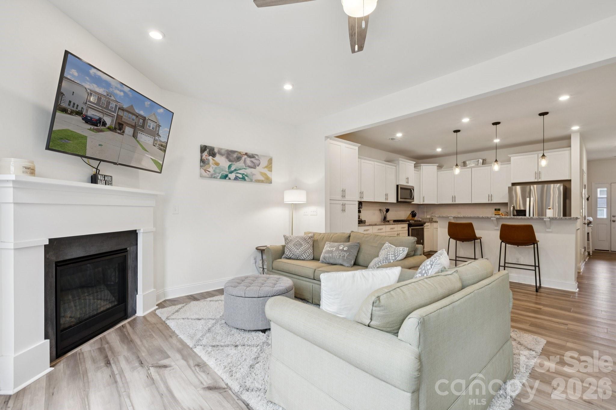 2081 Suttonview Road Fort Mill, SC 29708 - Photo 9 of 33 a living room with furniture and a fireplace