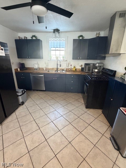 1148 Riverside Avenue Wellsville, OH 43968 - Photo 5 of 14 Kitchen featuring stove, extractor fan, refrigerator, dishwashing machine, and a textured ceiling
