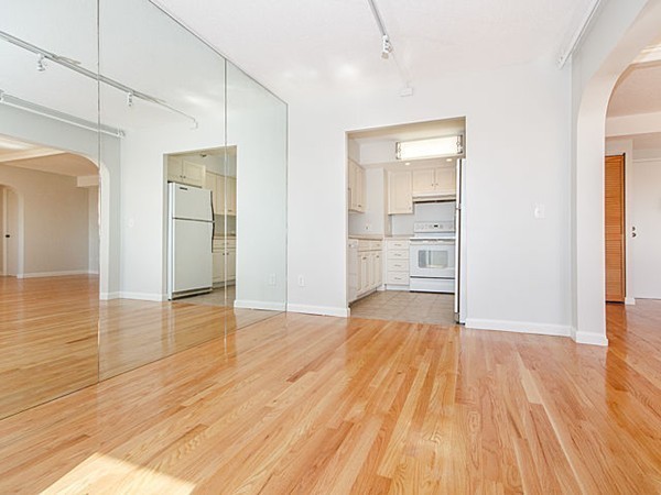 1731 Beacon Street, Unit 1110 Brookline, MA 02445 - Photo 3 of 24 a view of empty room with wooden floor