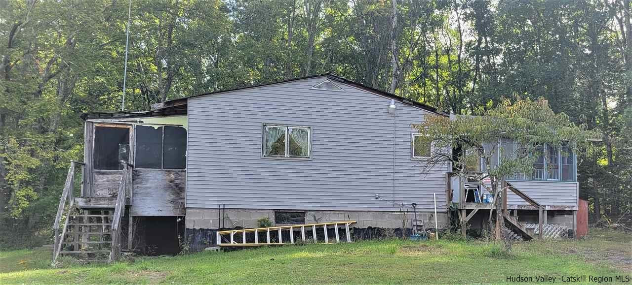 53 Coxing Road Cottekill, NY 12419 - Photo 2 of 13 a backyard of a house with table and chairs