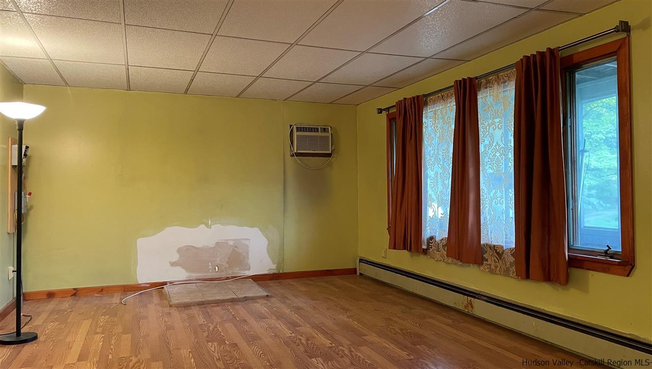 53 Coxing Road Cottekill, NY 12419 - Photo 4 of 13 a view of a room with wooden floor and windows