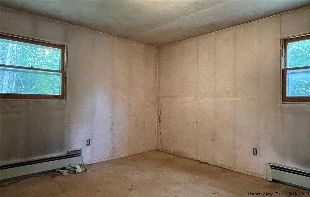 53 Coxing Road Cottekill, NY 12419 - Photo 7 of 13 an empty room with windows
