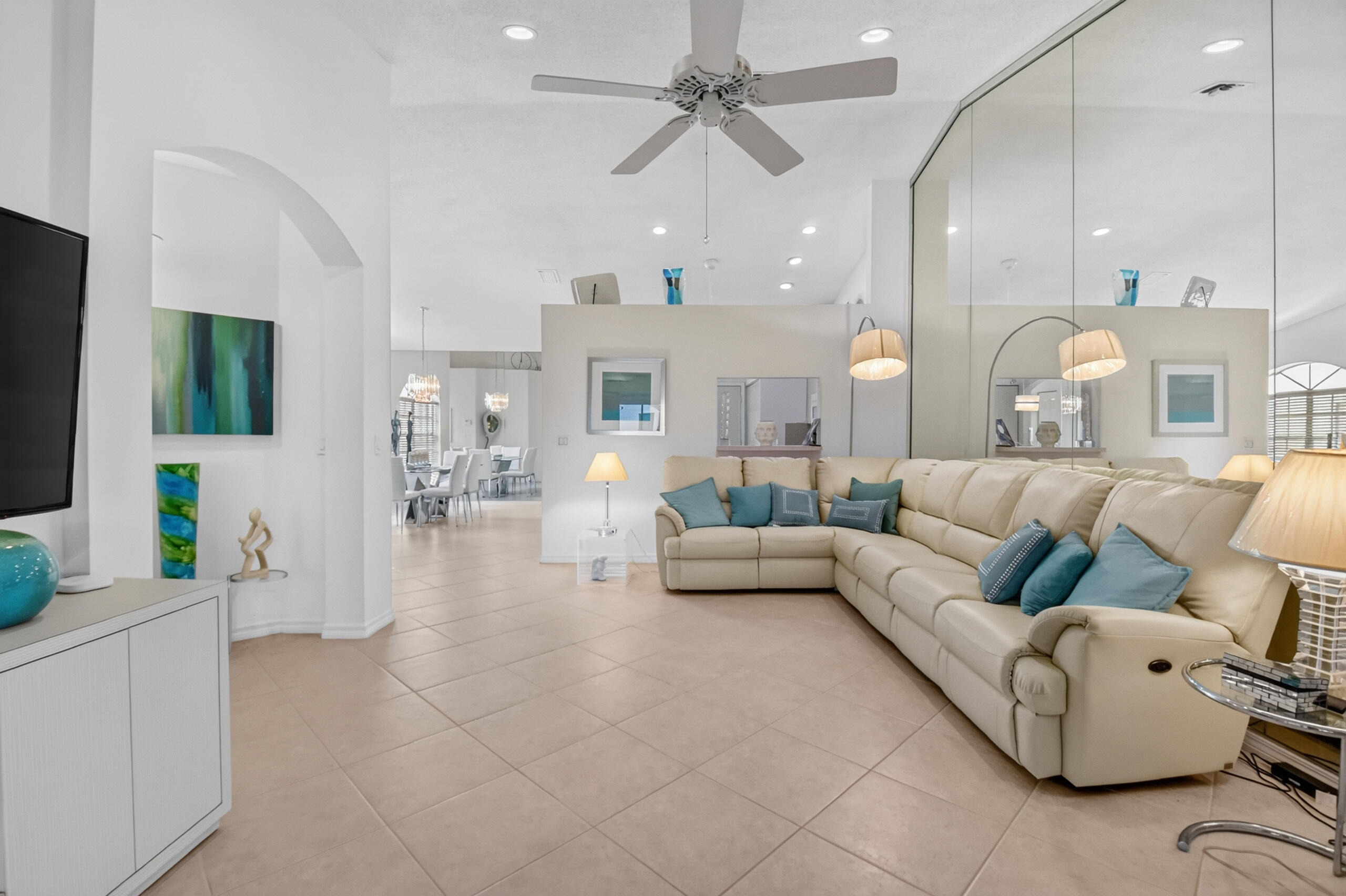 15340 Floral Club Road Delray Beach, FL 33484 - Photo 16 of 42 a living room with furniture kitchen view and a chandelier