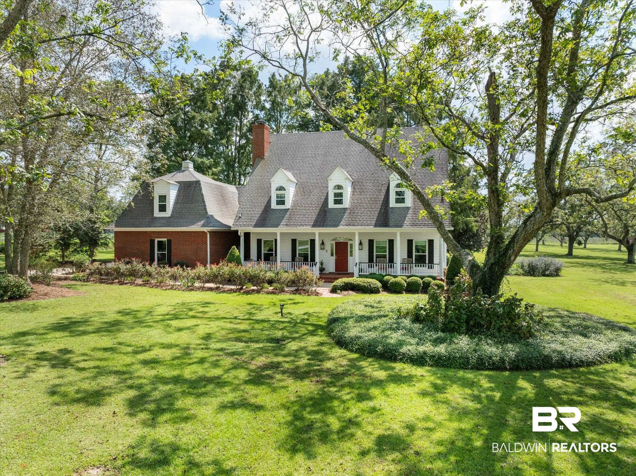 5231 Dawes Road Grand Bay, AL 36541 - Photo 1 of 49 Cape cod-style house with a front yard and covered porch