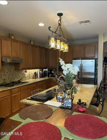 a view of a kitchen and dining area