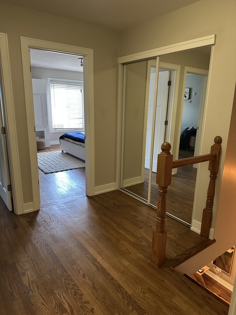 9830 Sayre Avenue, Unit 13 Chicago Ridge, IL 60415 - Photo 32 of 34 a view of a hallway with wooden floor