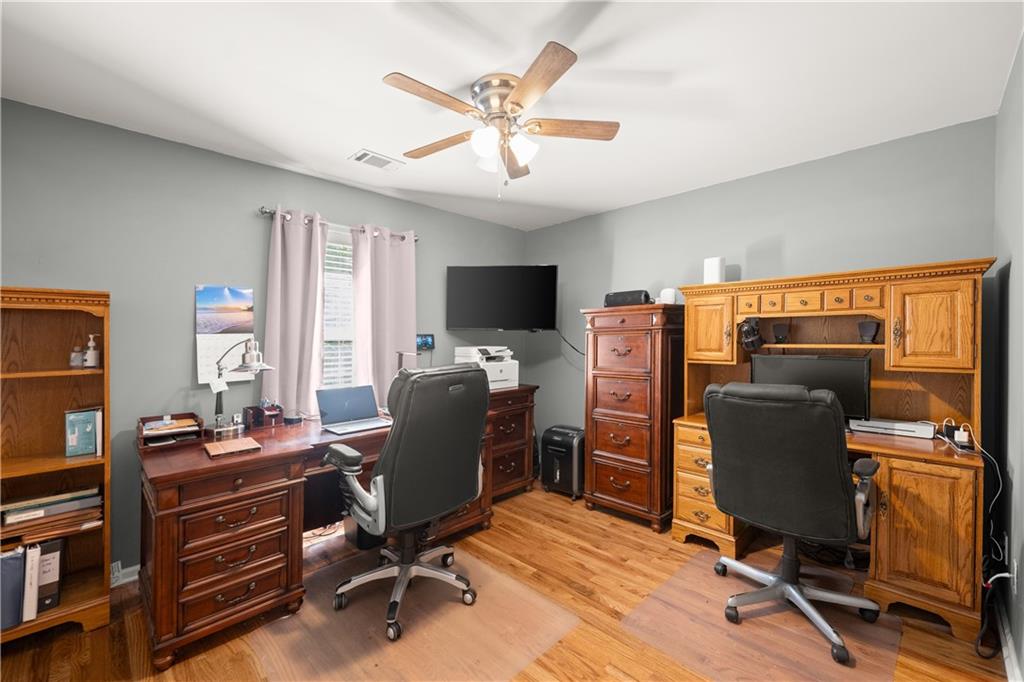 745 Roland Manor Drive Dacula, GA 30019 - Photo 32 of 63 a view of a workspace with furniture and a window
