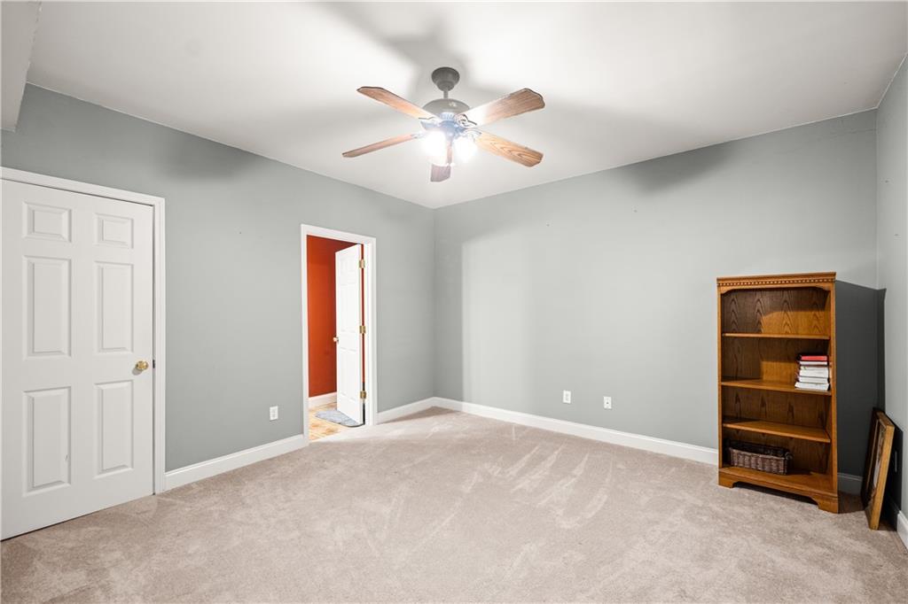 745 Roland Manor Drive Dacula, GA 30019 - Photo 34 of 63 a view of an empty room with a window