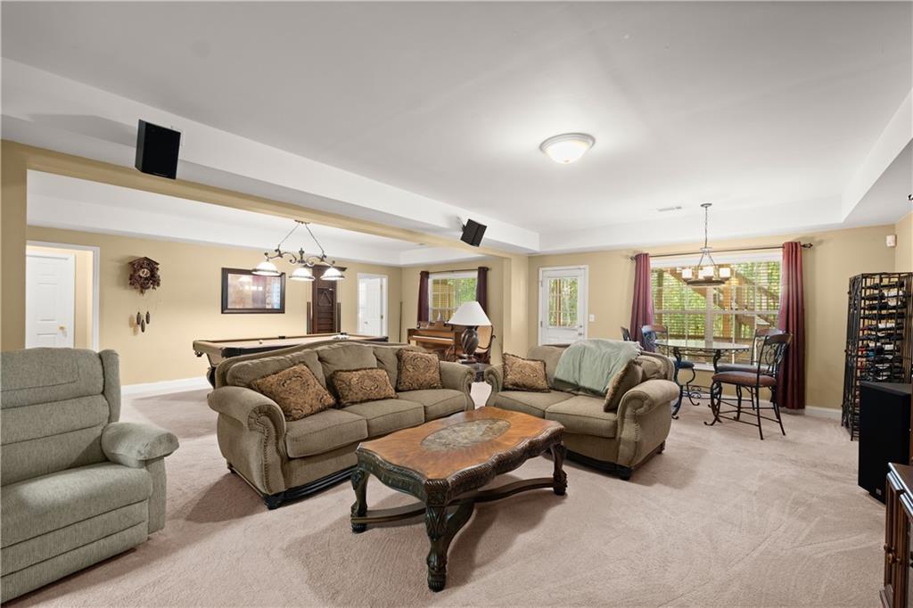 745 Roland Manor Drive Dacula, GA 30019 - Photo 41 of 63 a living room with furniture and a large window
