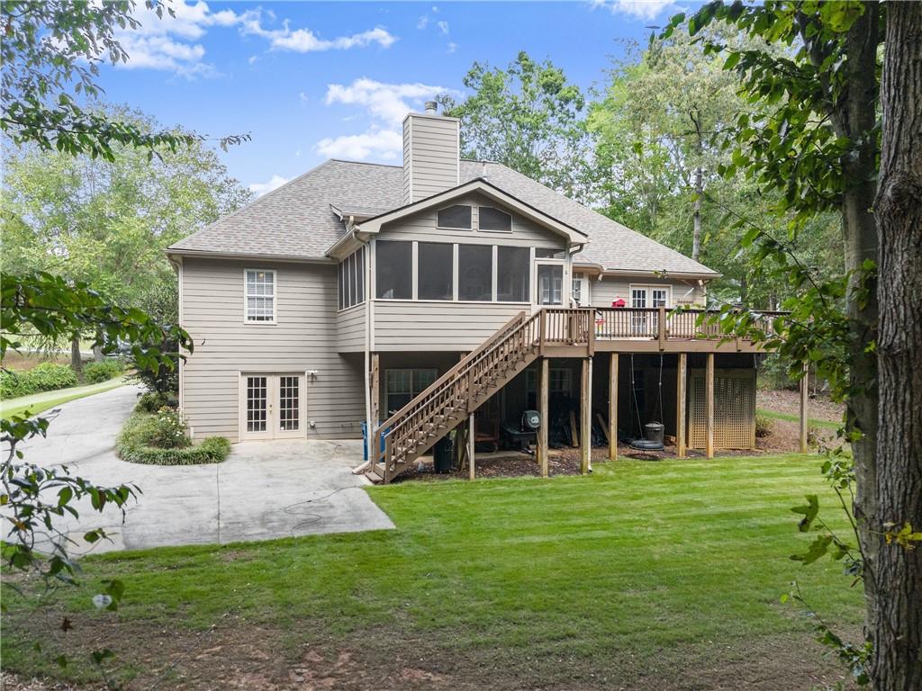 745 Roland Manor Drive Dacula, GA 30019 - Photo 54 of 63 a front view of a house with a yard