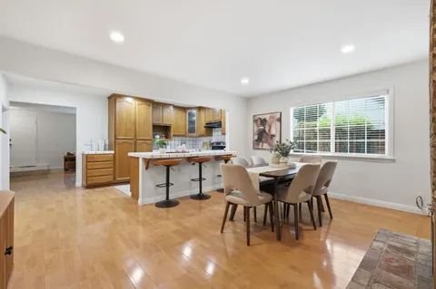 a dining room with furniture and window