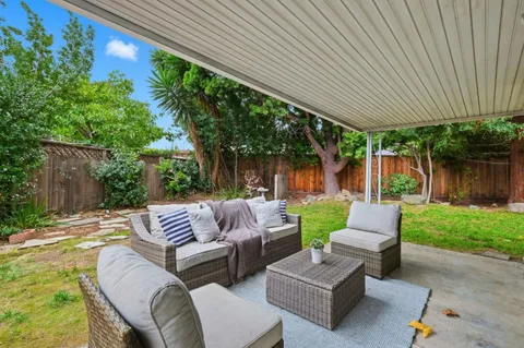 a outdoor living space with furniture and garden
