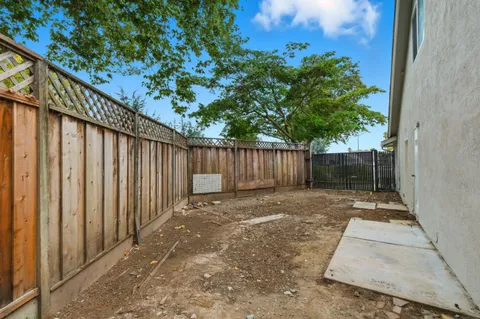 a view of outdoor space with wooden fence