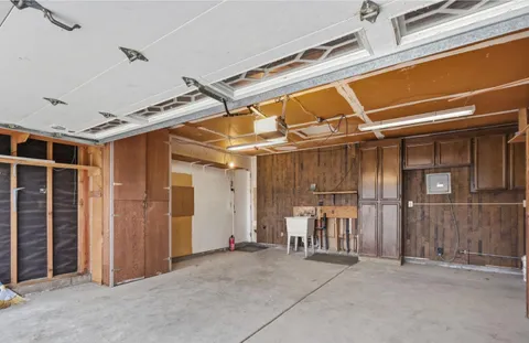 a view of an empty room with wooden walls