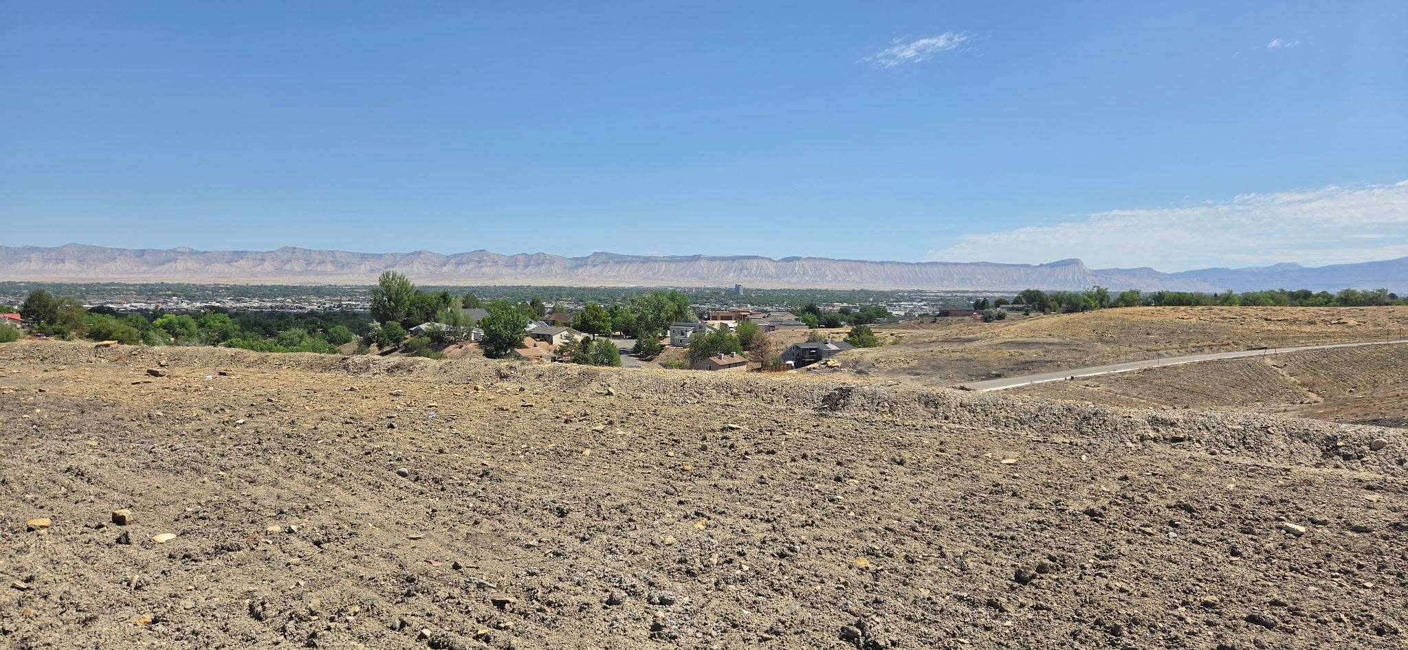 2410 Talus Lane Grand Junction, CO 81507 - Photo 8 of 10 a view of a lake with mountains in the background
