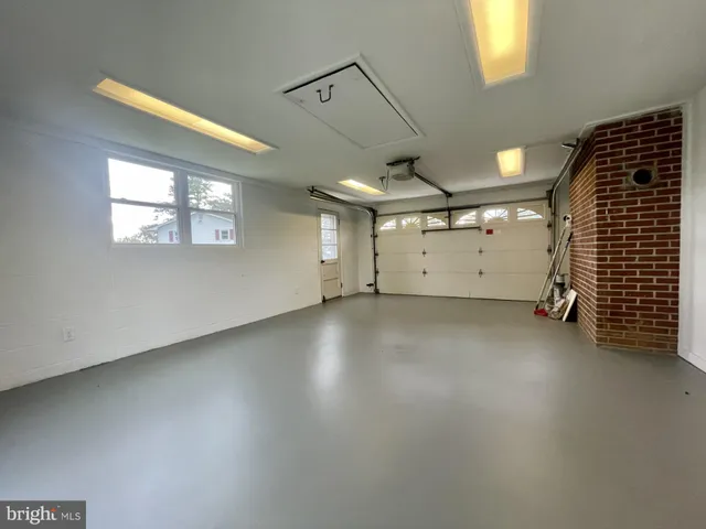 a view of a livingroom with a dishwasher and a window