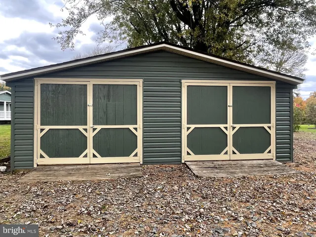 a outdoor space of a house with a large tree