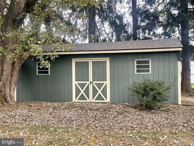 a house with trees in the background