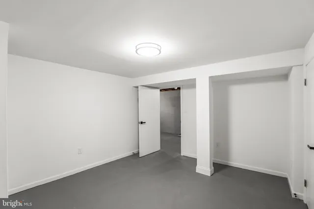 a kitchen with stainless steel appliances kitchen island wooden cabinets a refrigerator a stove a sink and a wooden floors