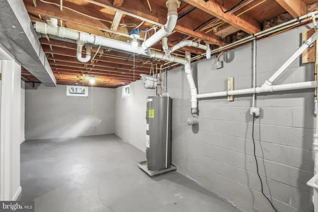 a front view of a house with a garden and yard