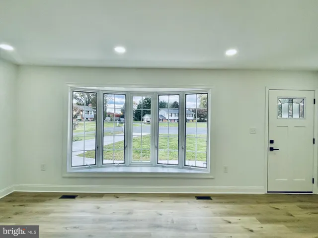 a view of wooden floor and a window