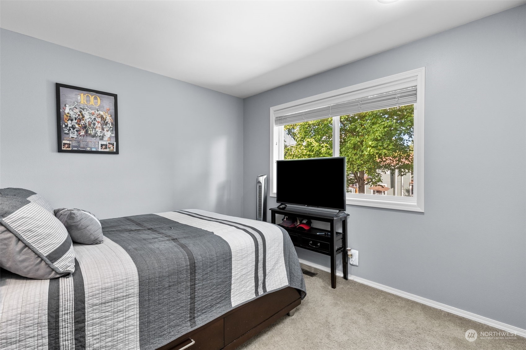 5122 Northeast 17th Street Renton, WA 98059 - Photo 26 of 35 a bedroom with a bed and a flat screen tv