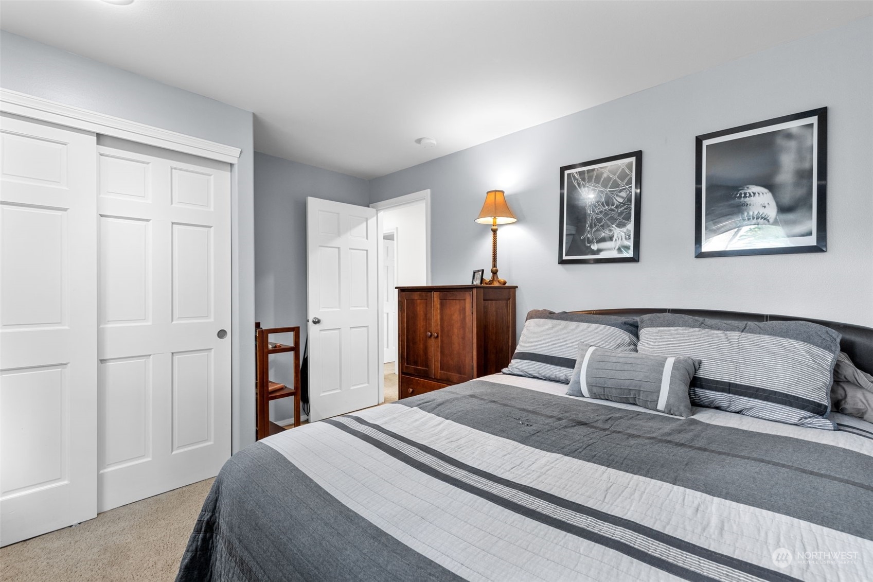 5122 Northeast 17th Street Renton, WA 98059 - Photo 27 of 35 a bedroom with a bed and a painting on the wall