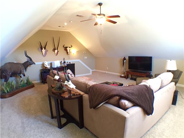 525 Sugar Flat Road Lebanon, TN 37087 - Photo 15 of 20 a living room with furniture and a chandelier